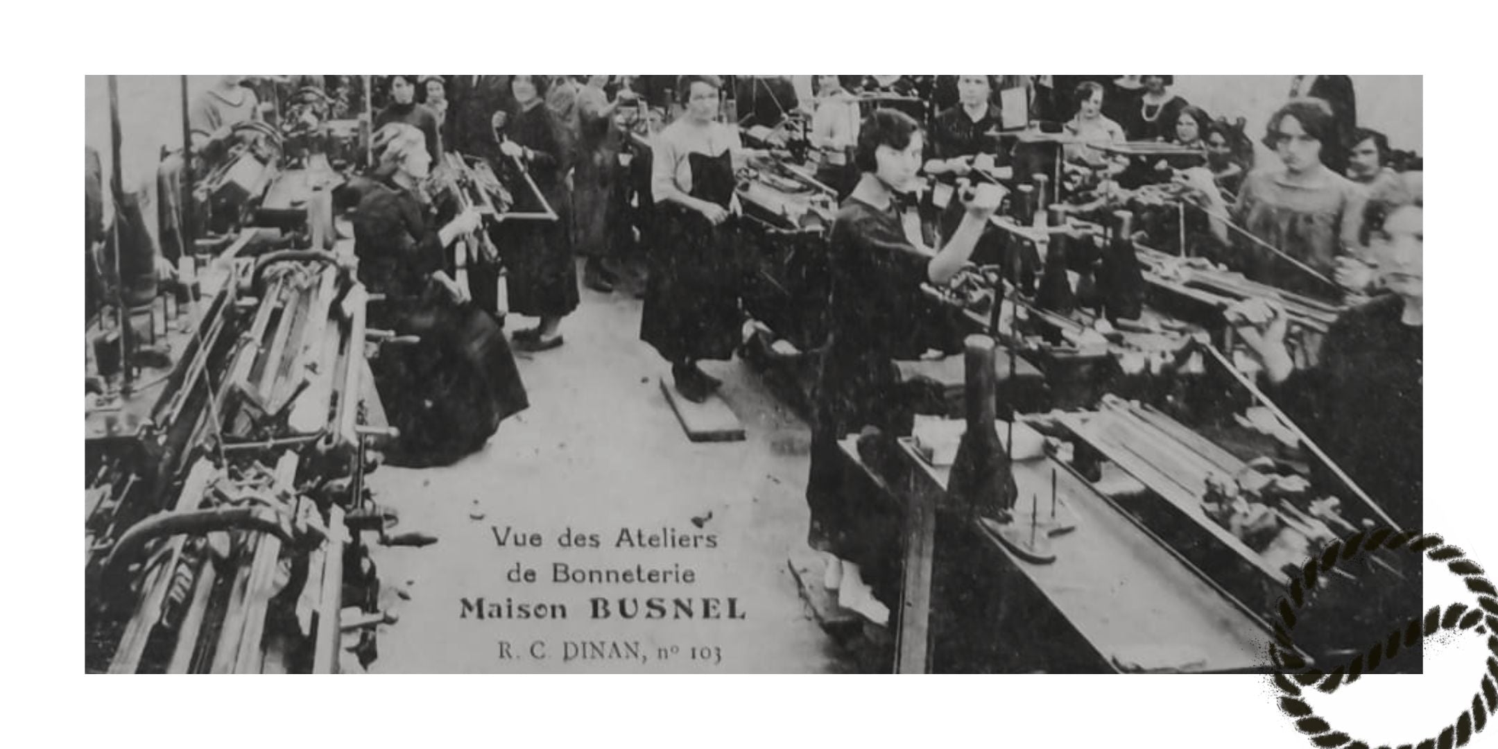 Vintage image from busnel factory in 1920's. Women standing and sitting in front of old sewing machines.