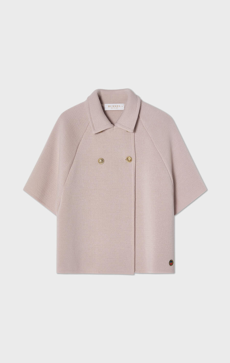 Gertrude stickad cape i ull ljusrosa